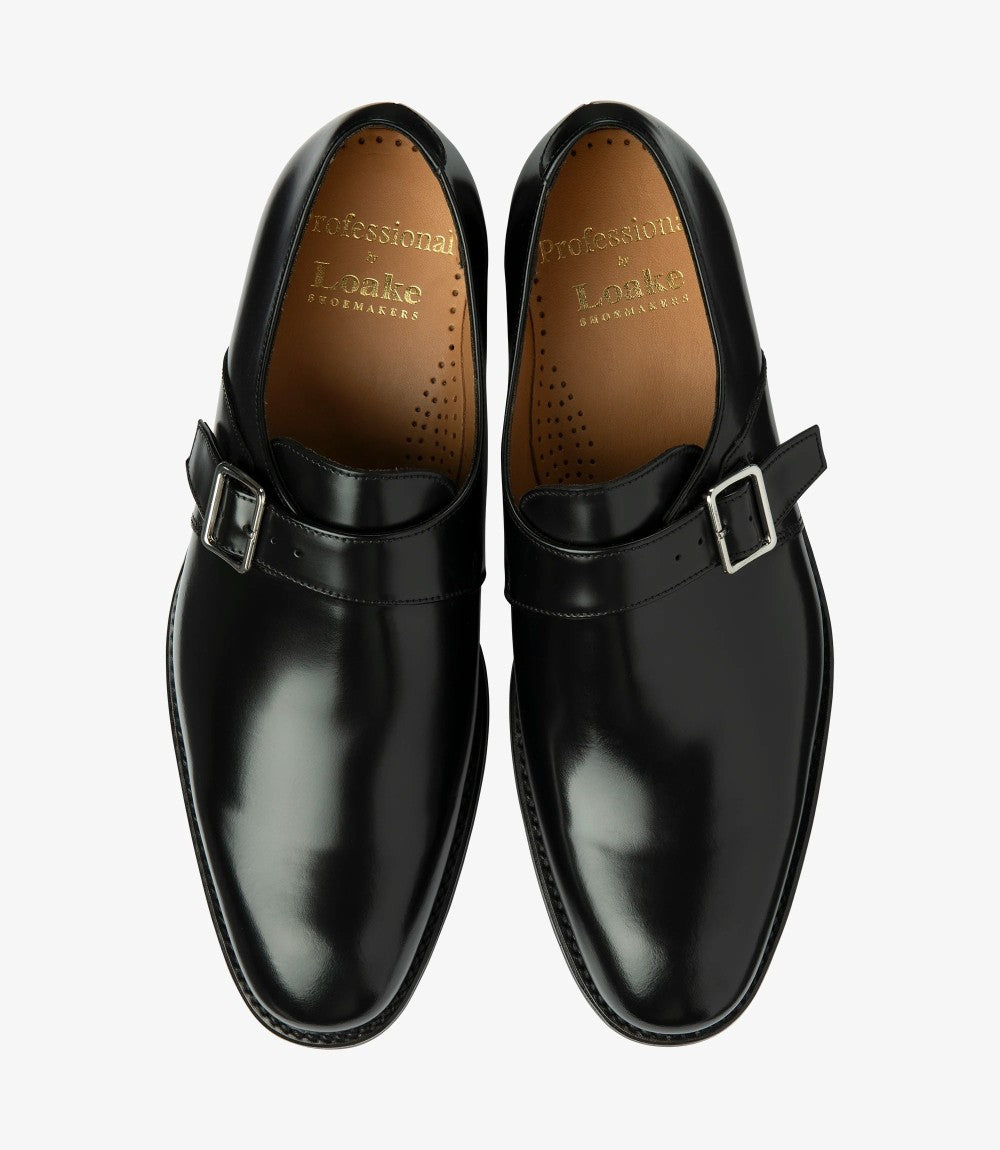 A top-down view of the pair, displaying the symmetrical design, lace-up closure, and sleek silhouette. The rich black leather is accentuated by the contrast between the shoe's upper and the toe-cap detailing, offering a balanced and professional look.