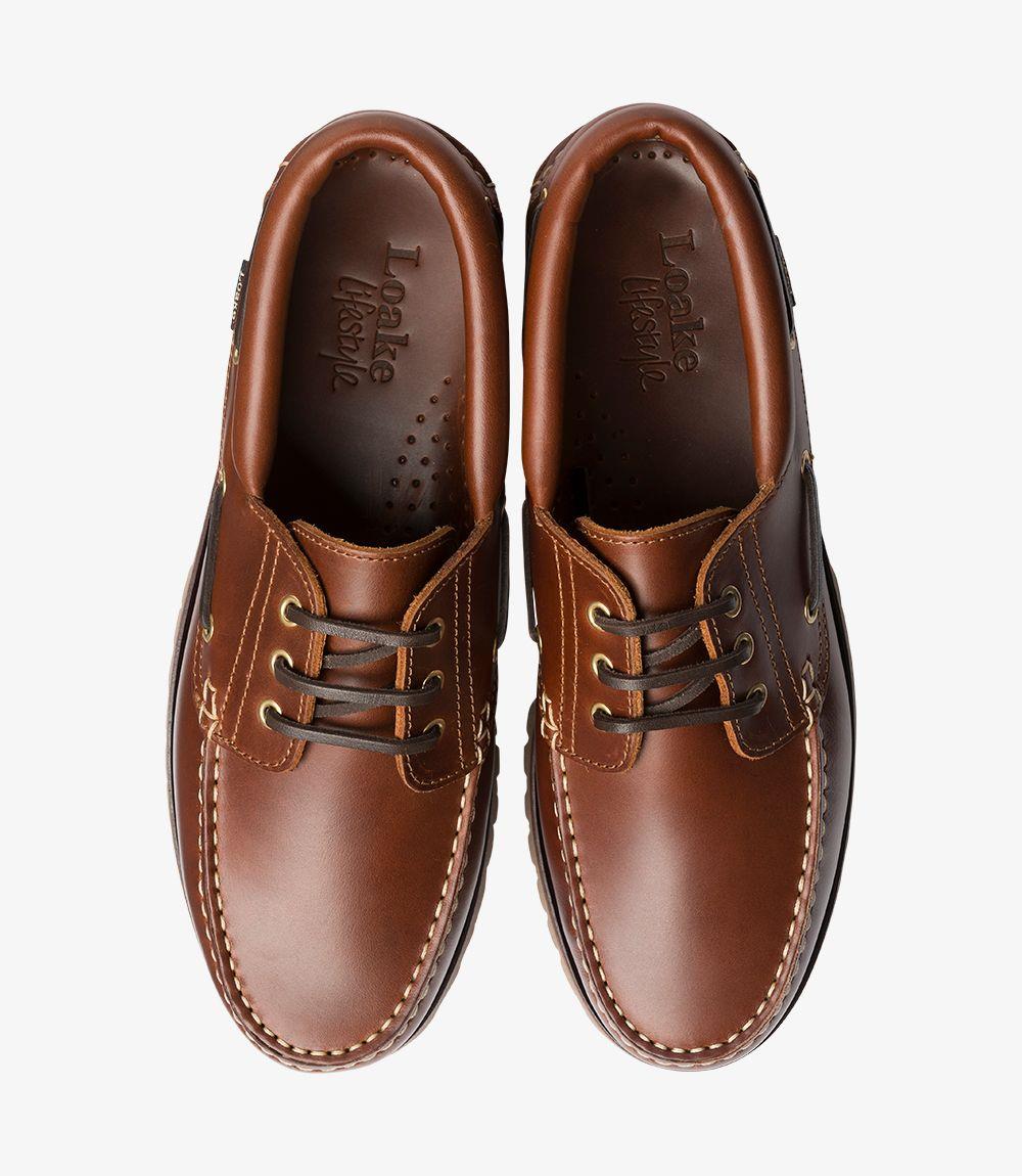 A pair of 522-DIS Brown Boat Shoes placed side by side, showcasing the complete view of both shoes. This image displays the overall design, the uniformity of the waxed leather, and the quality of the moccasin heavy deck rubber soles. The photo also captures the fully leather-lined interior, emphasizing comfort and luxury.