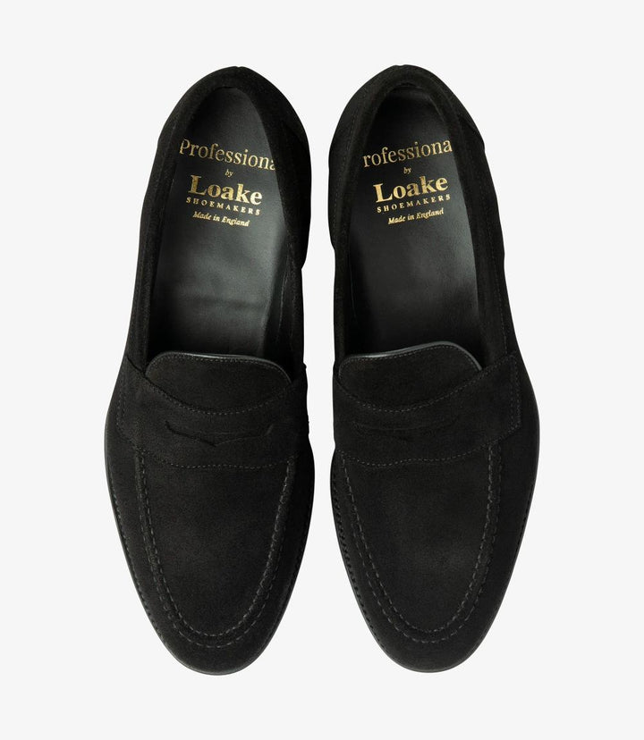 The overhead view of the Imperial Suede Black Loafers presents both shoes side by side, offering a comprehensive look at their sophisticated design. The soft suede surfaces reflect a rich, inviting black tone, while the classic penny loafer style is highlighted by the distinctive cutout. The cushioned insoles are slightly visible, suggesting the comfort that awaits with each step. This view captures the elegant symmetry of the loafers, showcasing their timeless style and versatility for any gentleman's.