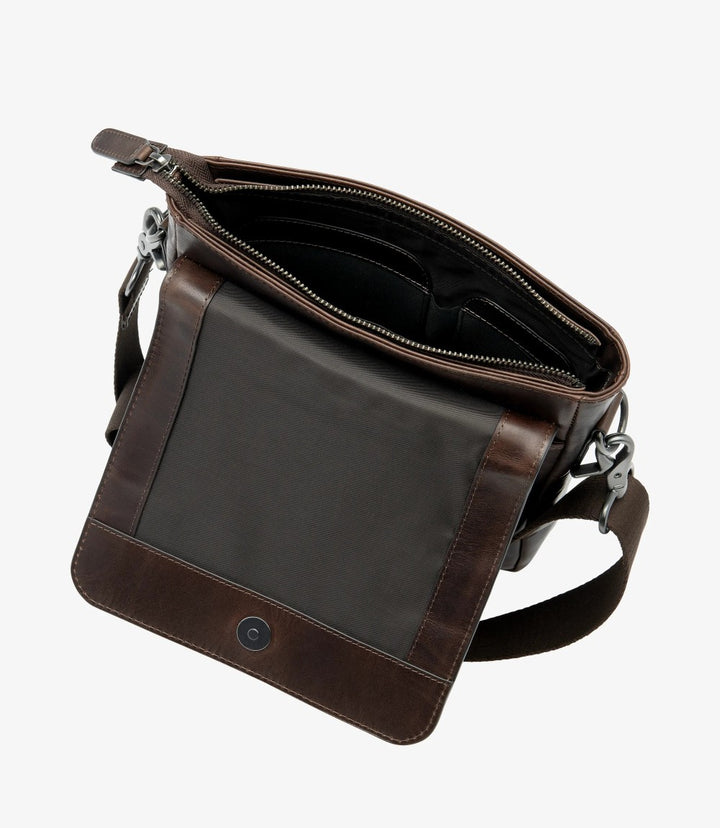 This interior shot reveals the spacious and thoughtfully organized compartment of the Loake Stratford Crossbody Bag. The fully leather-lined interior features a zip pocket underneath the flap, along with two slip pockets and a dedicated pen holder, ensuring that essentials are neatly arranged. The signature Loake lining adds a touch of elegance, while the rich brown hue complements the outer leather, making the interior both functional and stylish.