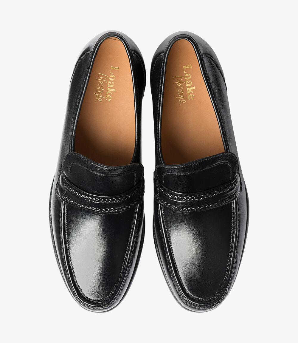 Viewed from above, both loafers display their symmetrical design, with clean lines and visible stitching around the toe box. The leather lining is subtly seen from this perspective, adding a hint of luxury to the interior.